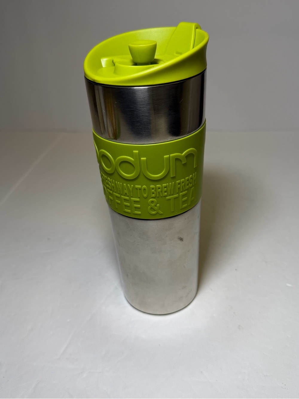 Bodum stainless steel travel French press with green accents coffee tea
